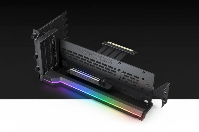 A black Parateks PCIe slot cover plate with a gold-plated PCIe connector visible at the top, shown on a black and white studio background.