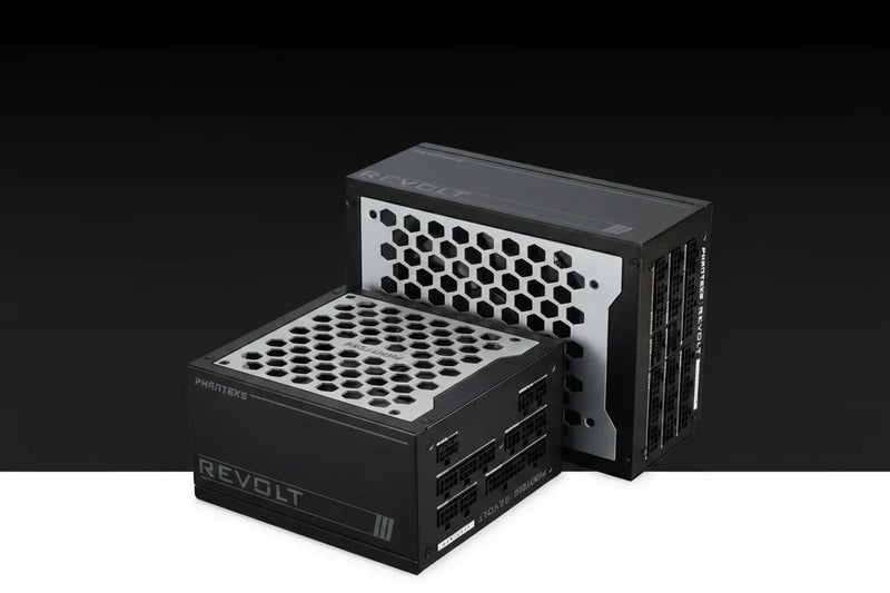 Two PC power supplies from the REVOLT series, one by PHINTEK48 in the foreground and one by ASRock in the background, shown on a black-to-white gradient studio background.